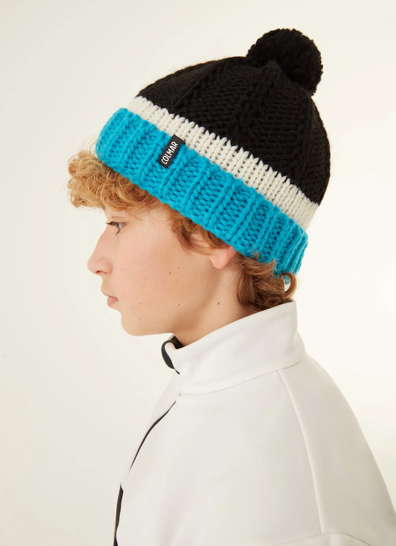 Junior unisex hat with turn-up and pompom